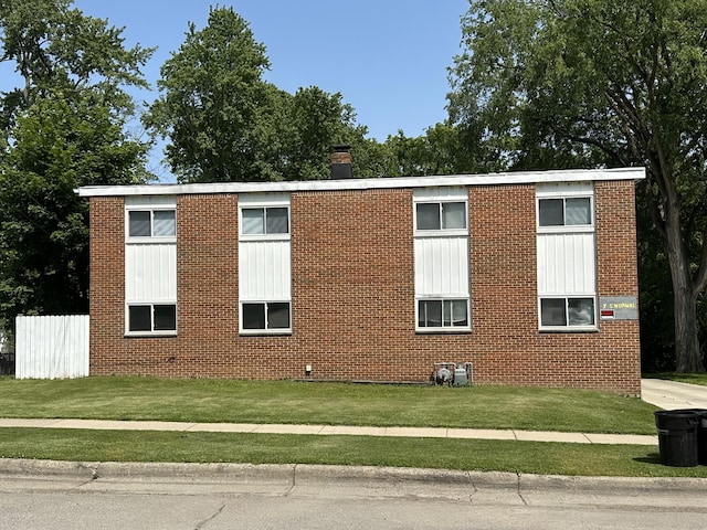 7 S Normal St, Ypsilanti, MI 48197 - view of property exterior with brick siding and a lawn