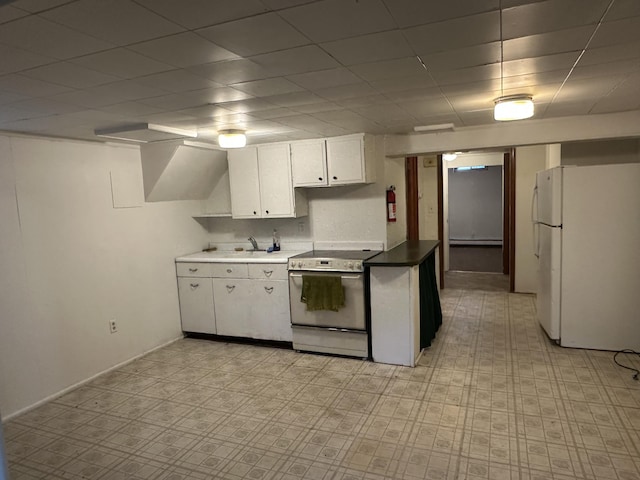 7 S Normal St, Ypsilanti, MI 48197 - kitchen featuring white appliances, white cabinets, light flooring, baseboard heating, and a drop ceiling