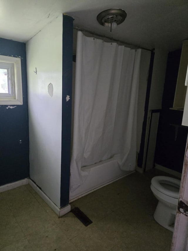 219 E Main St, Springport, MI 49284 - bathroom featuring a shower with curtain and tile patterned floors