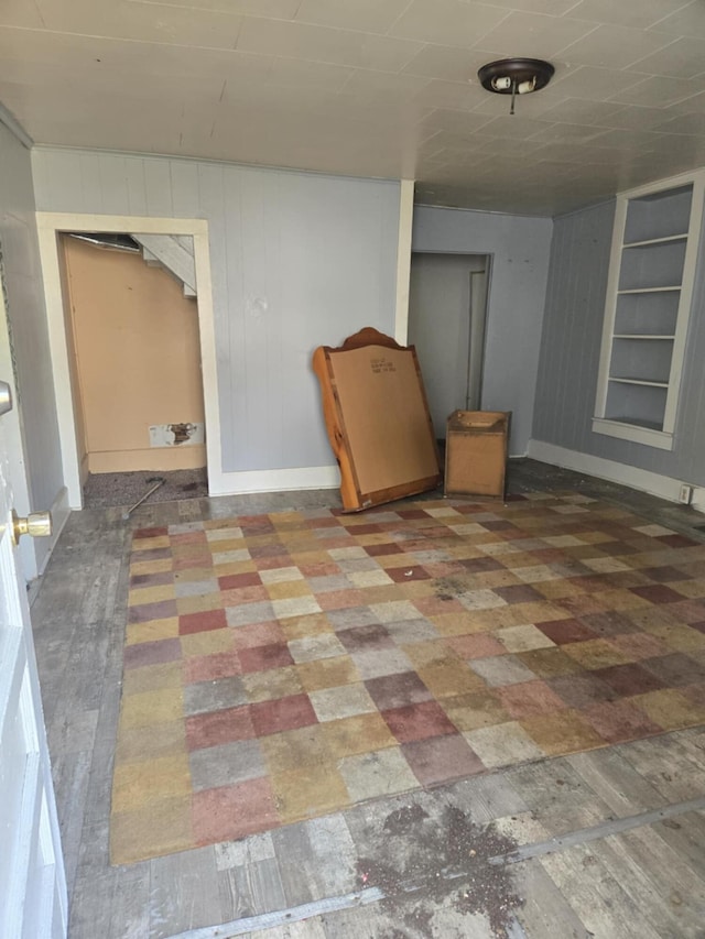 219 E Main St, Springport, MI 49284 - below grade area featuring built in features and wooden walls