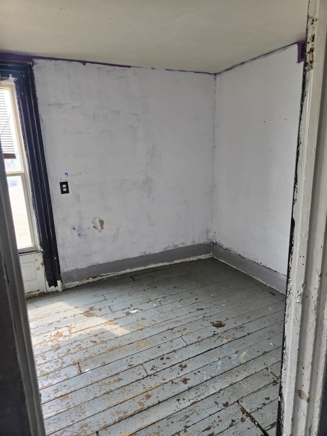 219 E Main St, Springport, MI 49284 - spare room featuring hardwood / wood-style floors