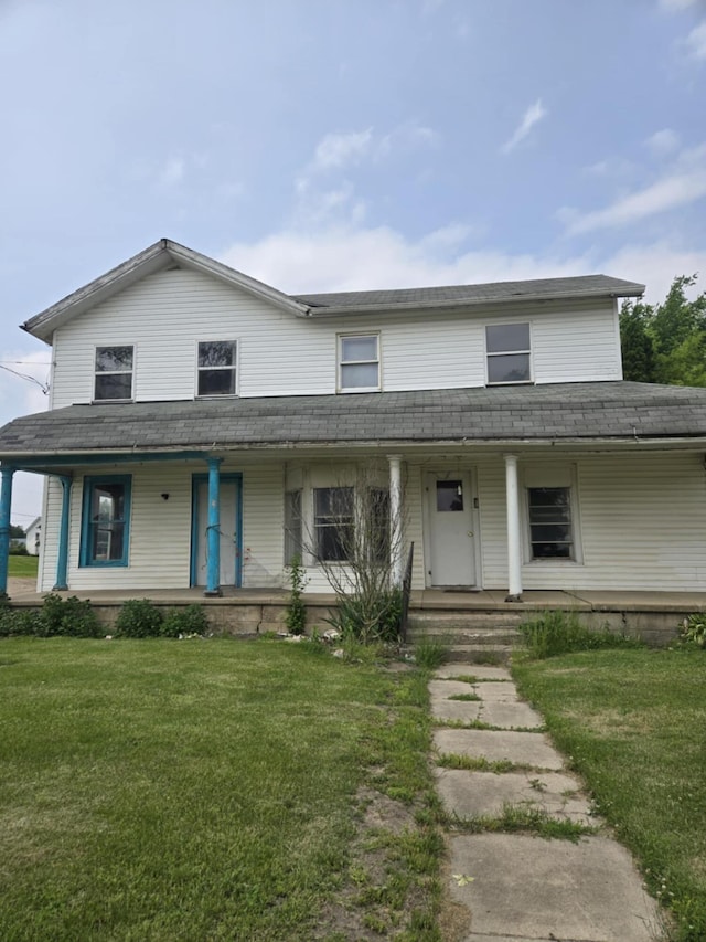 219 E Main St, Springport, MI 49284 - country-style home featuring covered porch and a front yard