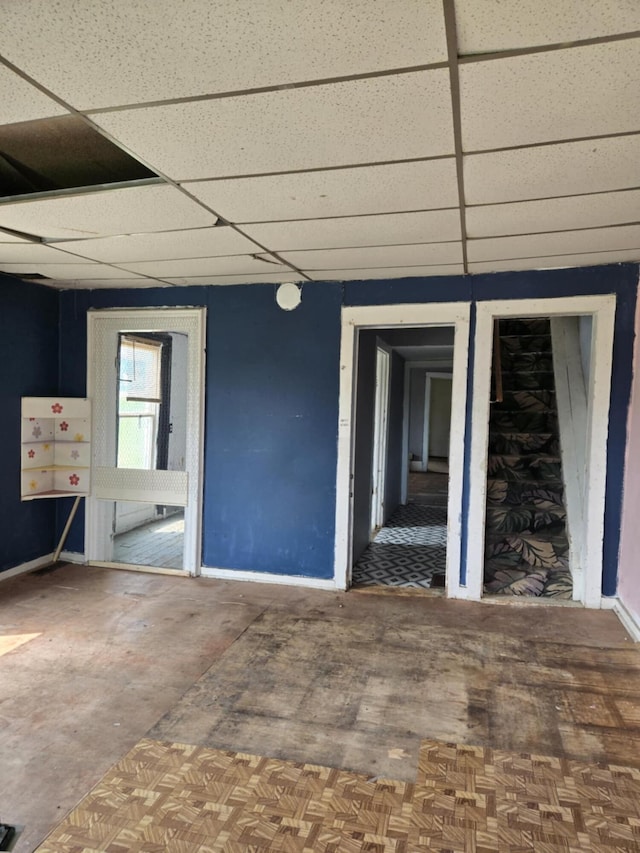 219 E Main St, Springport, MI 49284 - empty room featuring a paneled ceiling and baseboards