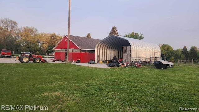 2025 W Rose Center Rd, Holly, MI 48442 - view of pole building featuring a yard and a carport