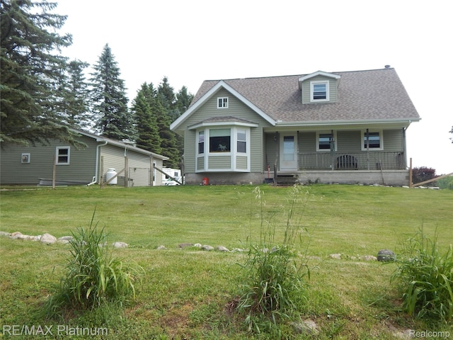 2025 W Rose Center Rd, Holly, MI 48442 - view of front of house with a porch, a front yard, and a shingled roof