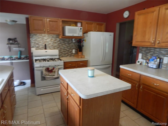 2025 W Rose Center Rd, Holly, MI 48442 - kitchen featuring white appliances, decorative backsplash, light countertops, light tile patterned floors, and brown cabinets