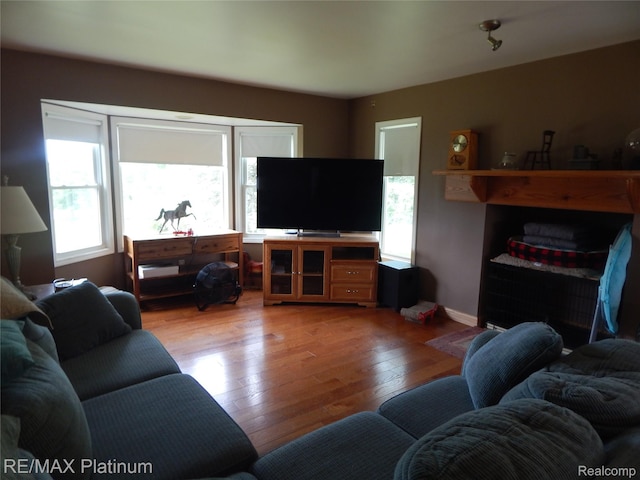2025 W Rose Center Rd, Holly, MI 48442 - living room featuring light wood-type flooring and baseboards