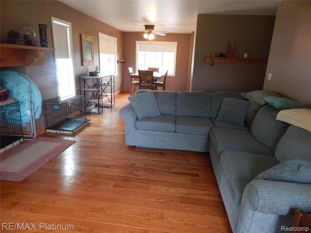 2025 W Rose Center Rd, Holly, MI 48442 - living area with light wood finished floors and ceiling fan