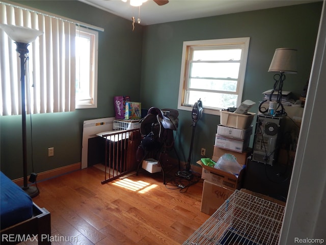 2025 W Rose Center Rd, Holly, MI 48442 - bedroom featuring wood finished floors and baseboards