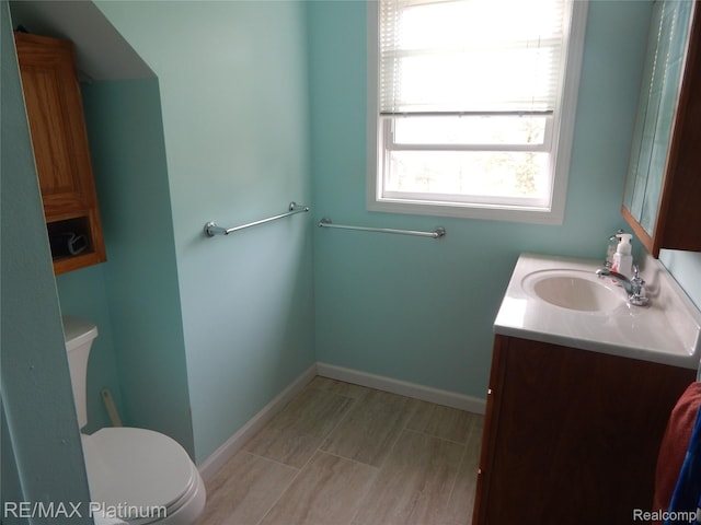 2025 W Rose Center Rd, Holly, MI 48442 - bathroom with vanity and toilet