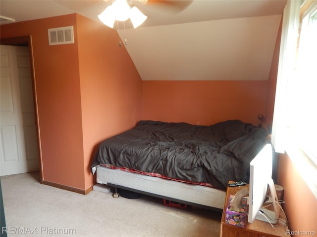 2025 W Rose Center Rd, Holly, MI 48442 - carpeted bedroom featuring vaulted ceiling and ceiling fan