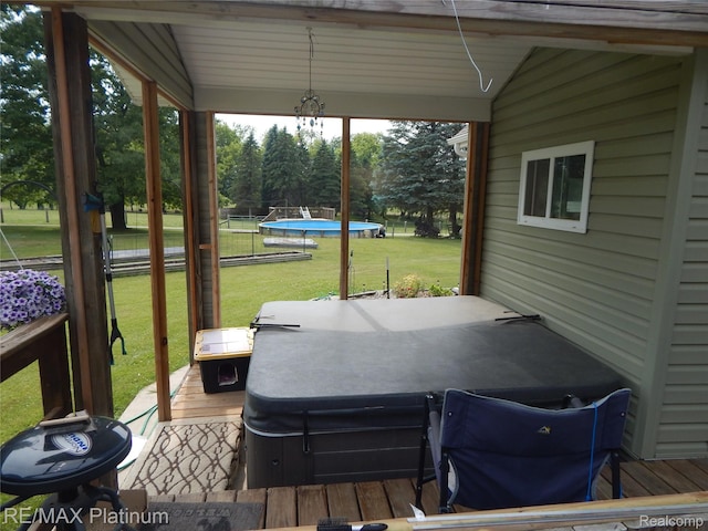 2025 W Rose Center Rd, Holly, MI 48442 - wooden deck featuring a covered hot tub and a lawn