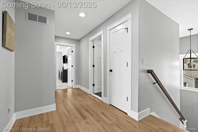 707 S Altadena Ave, Royal Oak, MI 48067 - hall featuring an upstairs landing, light wood-style floors, a chandelier, and recessed lighting
