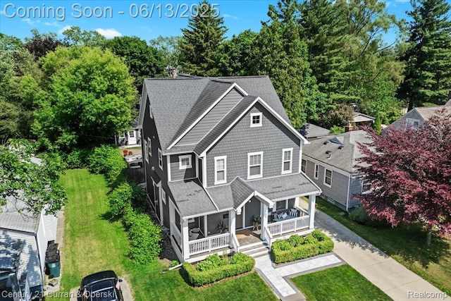 707 S Altadena Ave, Royal Oak, MI 48067 - view of front of home featuring covered porch, a shingled roof, driveway, and a front lawn