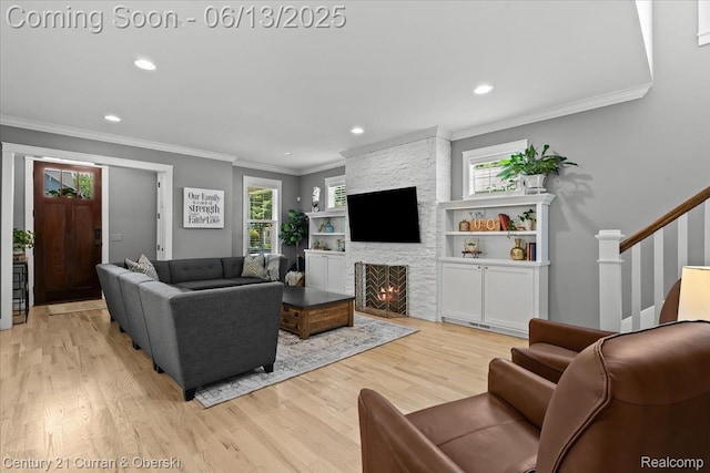 707 S Altadena Ave, Royal Oak, MI 48067 - living area featuring ornamental molding, wood finished floors, stairway, recessed lighting, and a stone fireplace