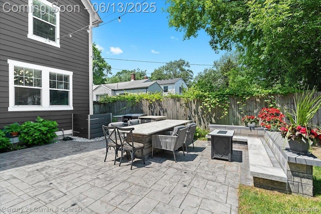 707 S Altadena Ave, Royal Oak, MI 48067 - fenced backyard with a fire pit, a patio, and outdoor dining space