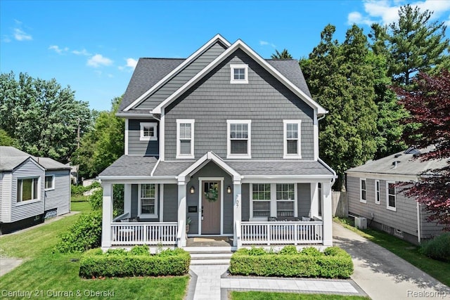 707 S Altadena Ave, Royal Oak, MI 48067 - view of front of home with a porch, a front lawn, driveway, and a shingled roof