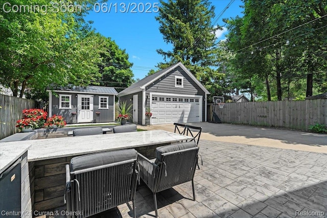707 S Altadena Ave, Royal Oak, MI 48067 - view of patio with an outbuilding and a detached garage