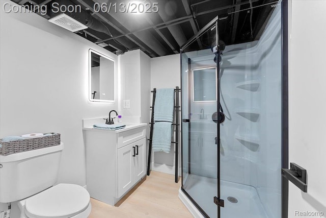 35245 Wick Rd, Romulus, MI 48174 - full bath with vanity, wood finished floors, and a stall shower
