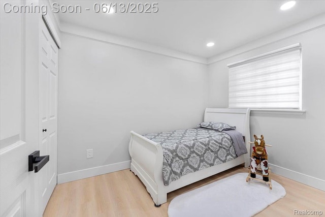 35245 Wick Rd, Romulus, MI 48174 - bedroom featuring wood finished floors, recessed lighting, and a closet