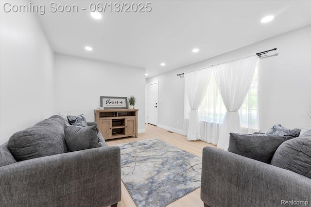 35245 Wick Rd, Romulus, MI 48174 - living area with light wood-style floors and recessed lighting