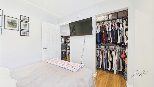 1204 Witham Rd, Muskegon, MI 49445 - bedroom featuring wood finished floors and a closet