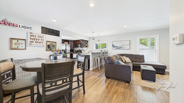 1204 Witham Rd, Muskegon, MI 49445 - dining area featuring light wood-type flooring and recessed lighting