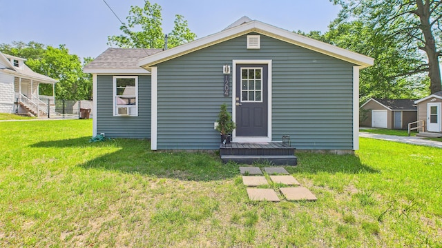 1204 Witham Rd, Muskegon, MI 49445 - view of front of home featuring an outbuilding and a front lawn