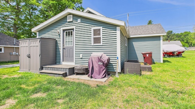 1204 Witham Rd, Muskegon, MI 49445 - rear view of property featuring a lawn