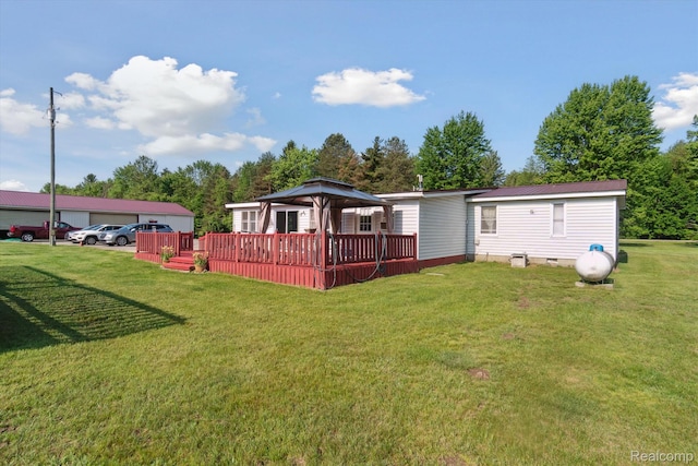 8031 Vassar Rd, Millington, MI 48746 - back of property featuring a gazebo, a wooden deck, a yard, a detached garage, and crawl space