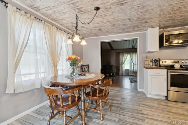 8031 Vassar Rd, Millington, MI 48746 - dining area with wood ceiling, light wood-style floors, and crown molding