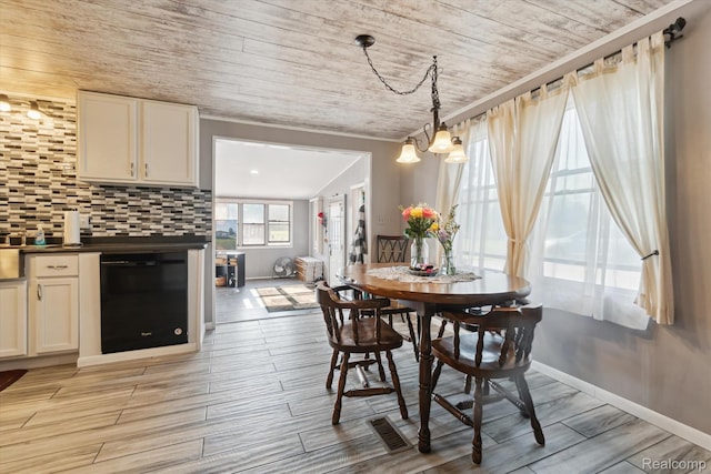 8031 Vassar Rd, Millington, MI 48746 - dining space featuring wood ceiling, light wood-type flooring, and a chandelier