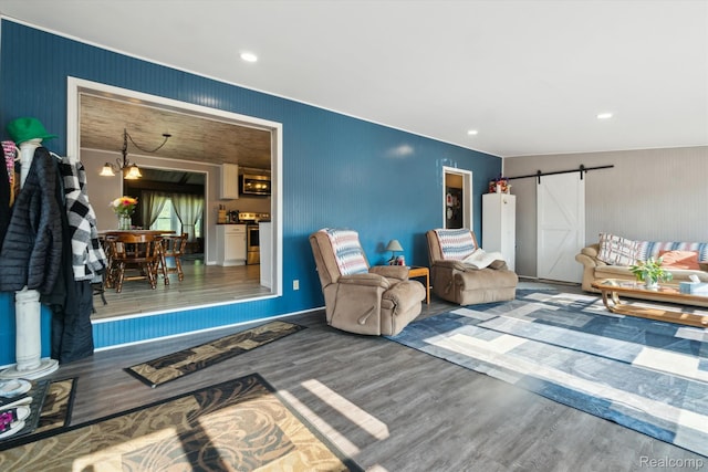 8031 Vassar Rd, Millington, MI 48746 - living area with wood finished floors, a barn door, and recessed lighting