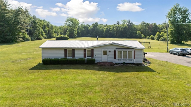 8031 Vassar Rd, Millington, MI 48746 - view of front facade featuring a front lawn and a metal roof