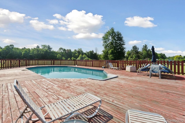 8031 Vassar Rd, Millington, MI 48746 - view of swimming pool with a deck and view of scattered trees