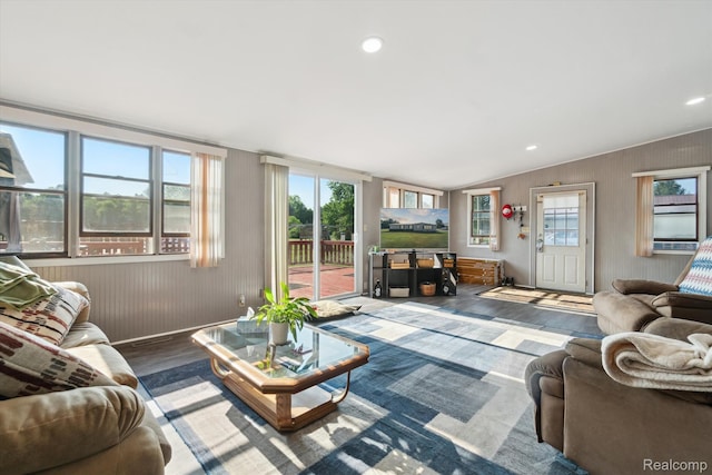 8031 Vassar Rd, Millington, MI 48746 - living room featuring wood finished floors, vaulted ceiling, wooden walls, and recessed lighting