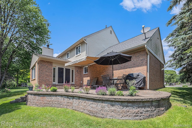 2842 Manorwood Dr, Troy, MI 48085 - rear view of property with brick siding, a patio area, and a yard