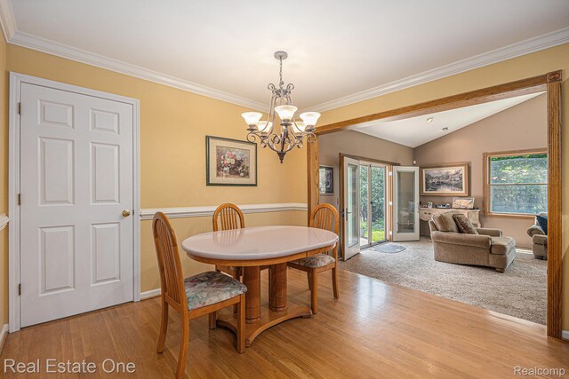 2842 Manorwood Dr, Troy, MI 48085 - dining space with light wood-style flooring, a chandelier, lofted ceiling, plenty of natural light, and crown molding