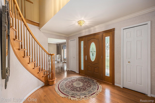 2842 Manorwood Dr, Troy, MI 48085 - foyer entrance featuring ornamental molding, wood finished floors, and stairway