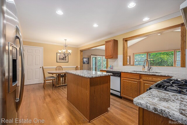 2842 Manorwood Dr, Troy, MI 48085 - kitchen featuring stainless steel fridge with ice dispenser, dishwasher, a kitchen island, brown cabinets, and plenty of natural light