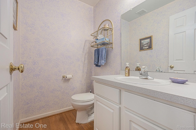 2842 Manorwood Dr, Troy, MI 48085 - half bathroom with wallpapered walls, wood finished floors, and vanity