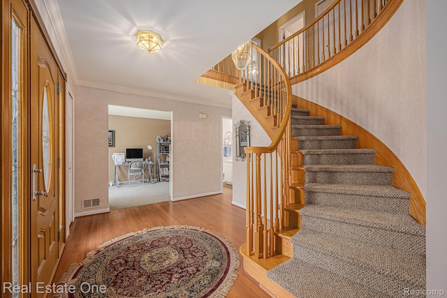 2842 Manorwood Dr, Troy, MI 48085 - stairs featuring crown molding and wood finished floors