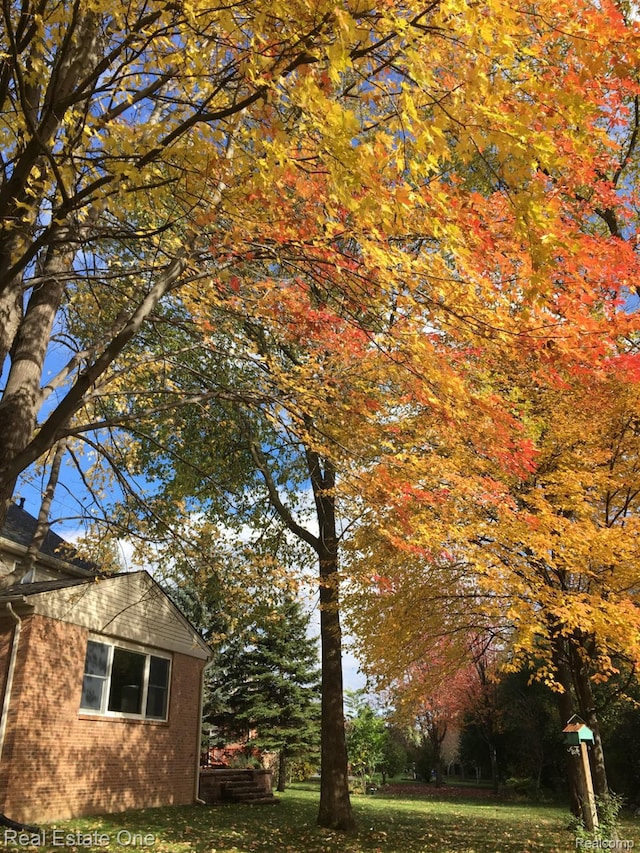 2842 Manorwood Dr, Troy, MI 48085 - view of home's exterior with brick siding and a yard