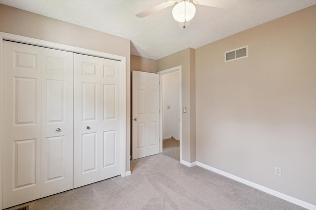 4540 Spinnaker Ln, Pleasant Lake, MI 49272 - unfurnished bedroom with light carpet, a closet, and a ceiling fan