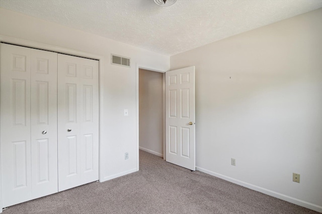 4540 Spinnaker Ln, Pleasant Lake, MI 49272 - unfurnished bedroom with carpet, a textured ceiling, and a closet