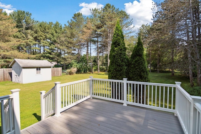 4540 Spinnaker Ln, Pleasant Lake, MI 49272 - wooden deck featuring a lawn and an outbuilding