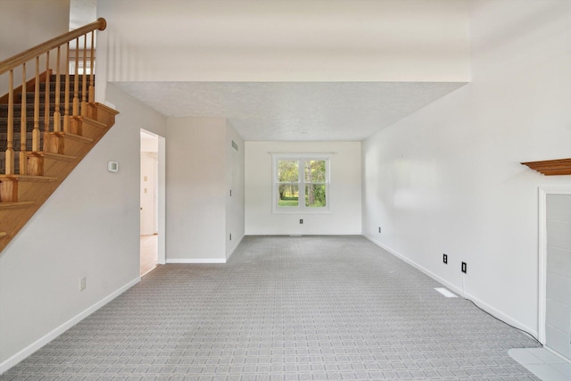 4540 Spinnaker Ln, Pleasant Lake, MI 49272 - unfurnished living room with carpet flooring and stairway