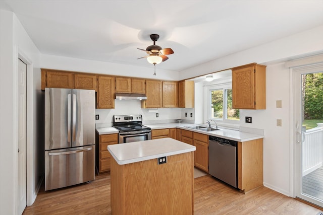 4540 Spinnaker Ln, Pleasant Lake, MI 49272 - kitchen with stainless steel appliances, light countertops, light wood-style flooring, and healthy amount of natural light