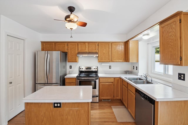 4540 Spinnaker Ln, Pleasant Lake, MI 49272 - kitchen with appliances with stainless steel finishes, under cabinet range hood, light countertops, and a ceiling fan