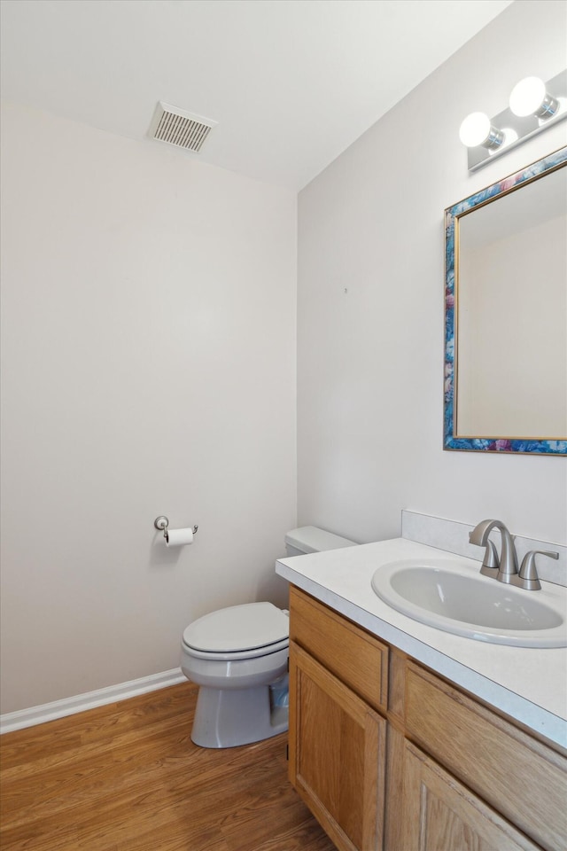 4540 Spinnaker Ln, Pleasant Lake, MI 49272 - half bathroom with vanity and wood finished floors